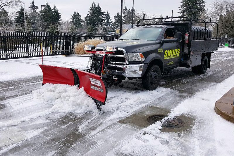 residential snow removal service by South Coast Group includes snow plowing, salt and sand application